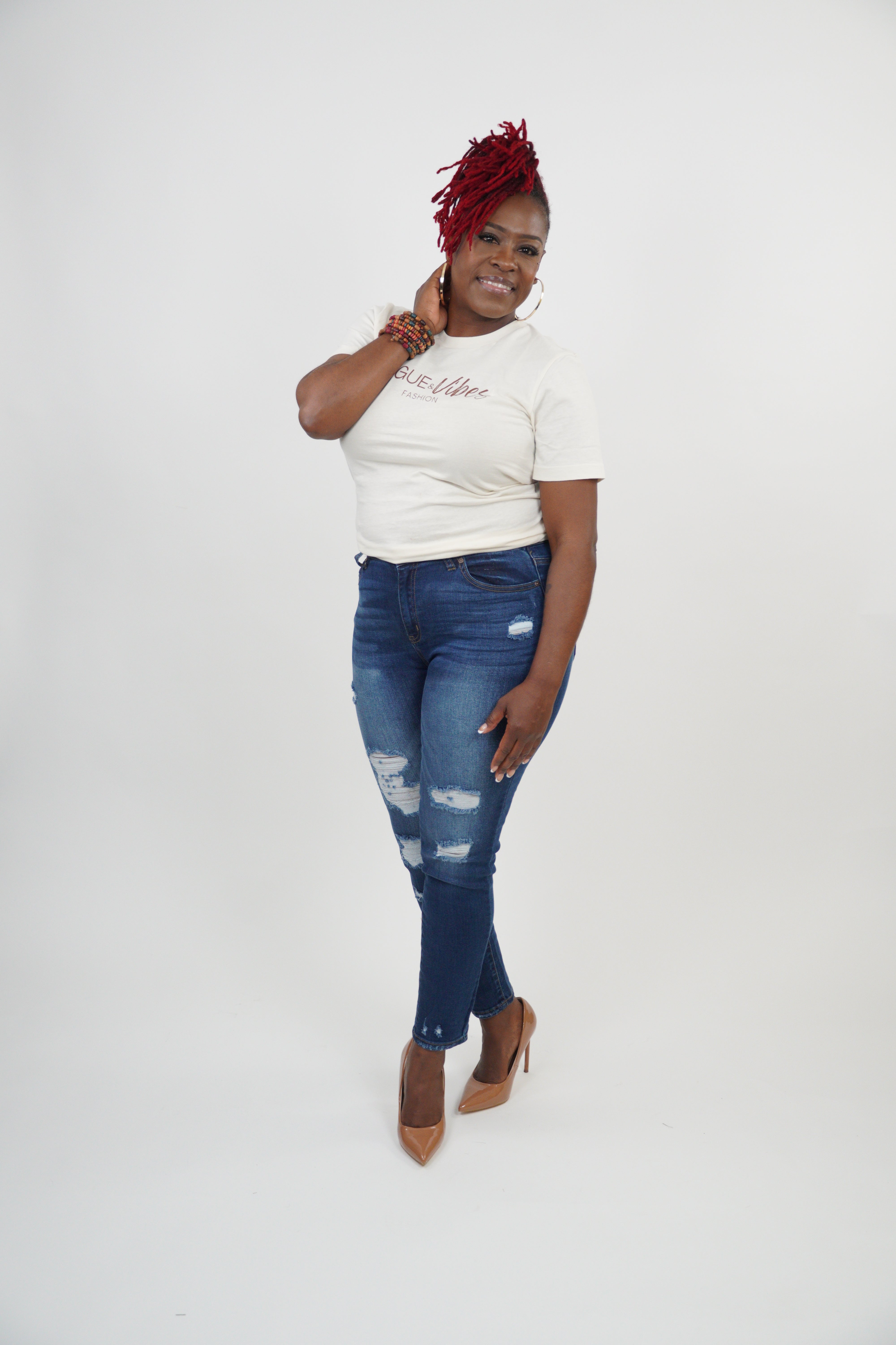 Distressed dark blue jeans