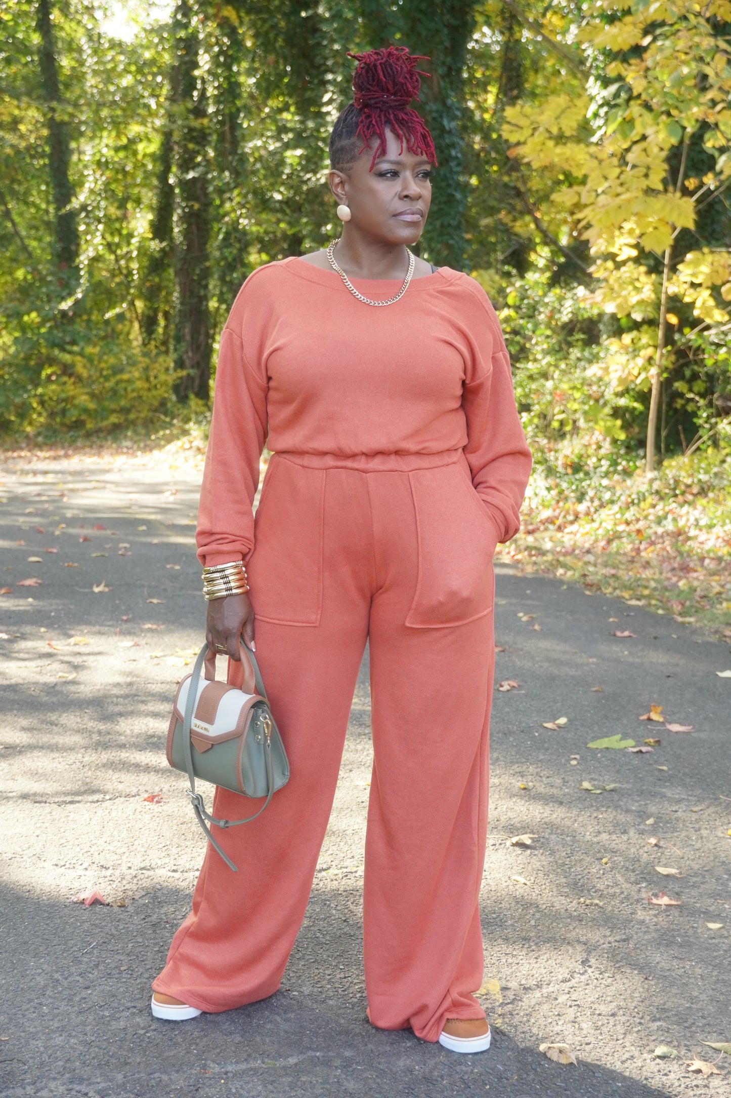 RUST LONG SLEEVE WIDE PANTS JUMPSUIT W/POCKETS AND OPEN BACK