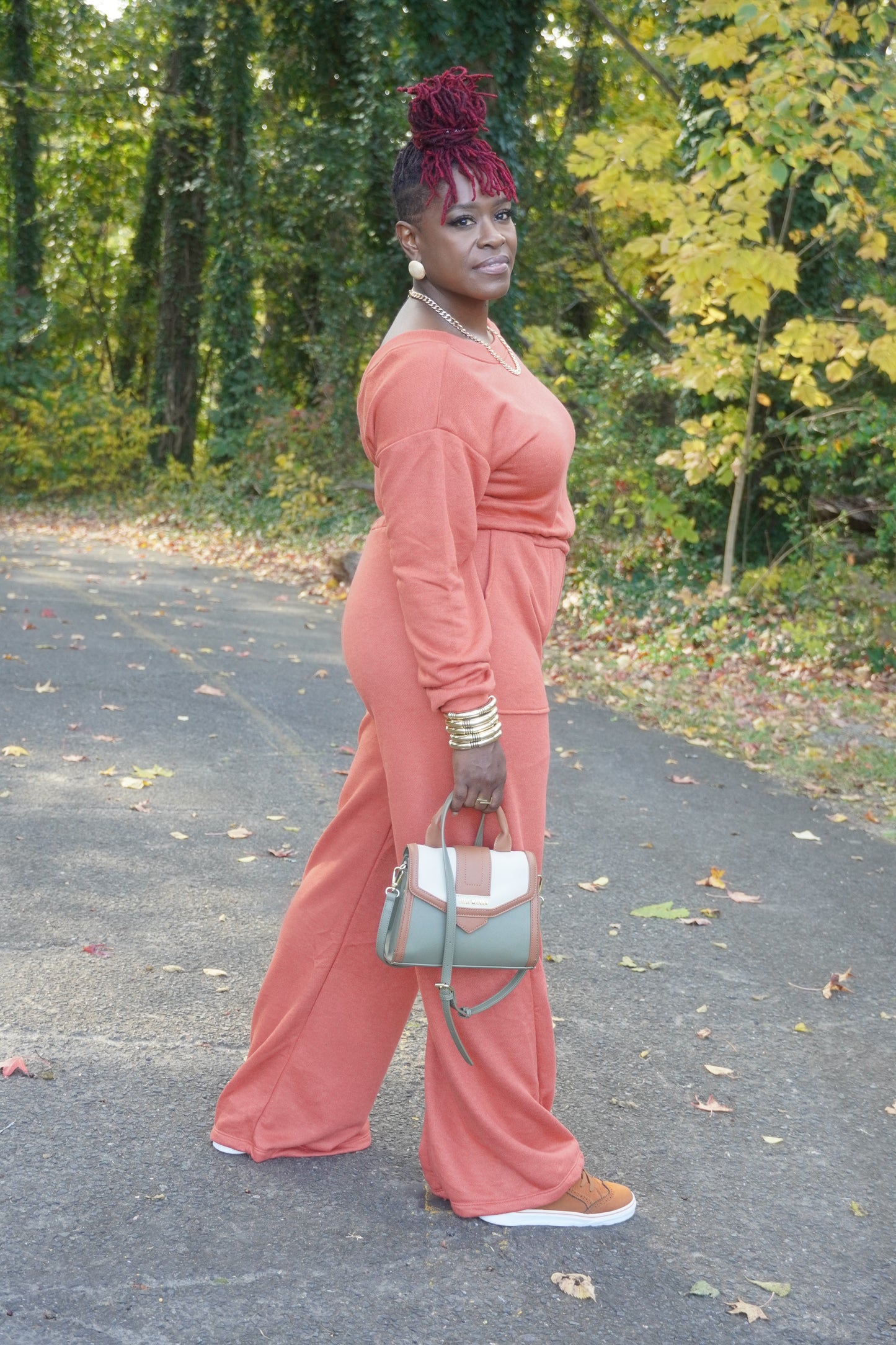 RUST LONG SLEEVE WIDE PANTS JUMPSUIT W/POCKETS AND OPEN BACK