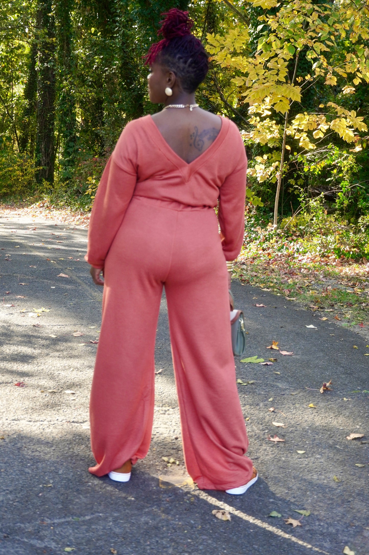 RUST LONG SLEEVE WIDE PANTS JUMPSUIT W/POCKETS AND OPEN BACK