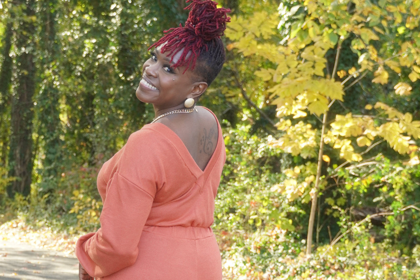 RUST LONG SLEEVE WIDE PANTS JUMPSUIT W/POCKETS AND OPEN BACK