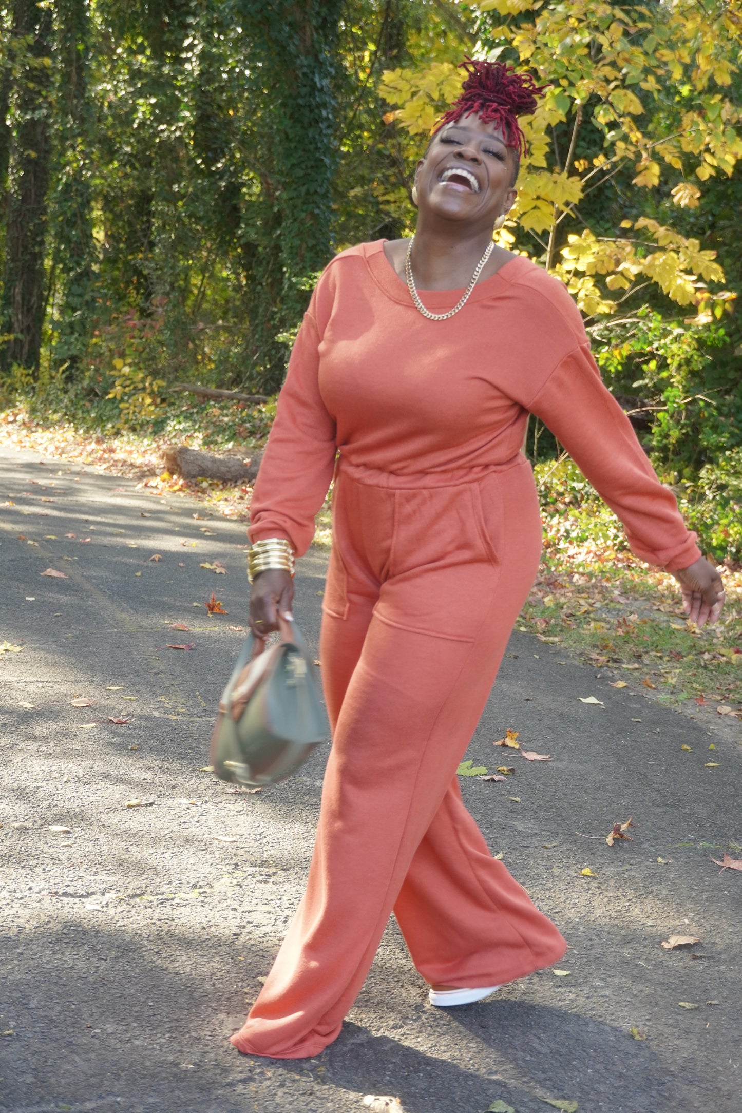 RUST LONG SLEEVE WIDE PANTS JUMPSUIT W/POCKETS AND OPEN BACK