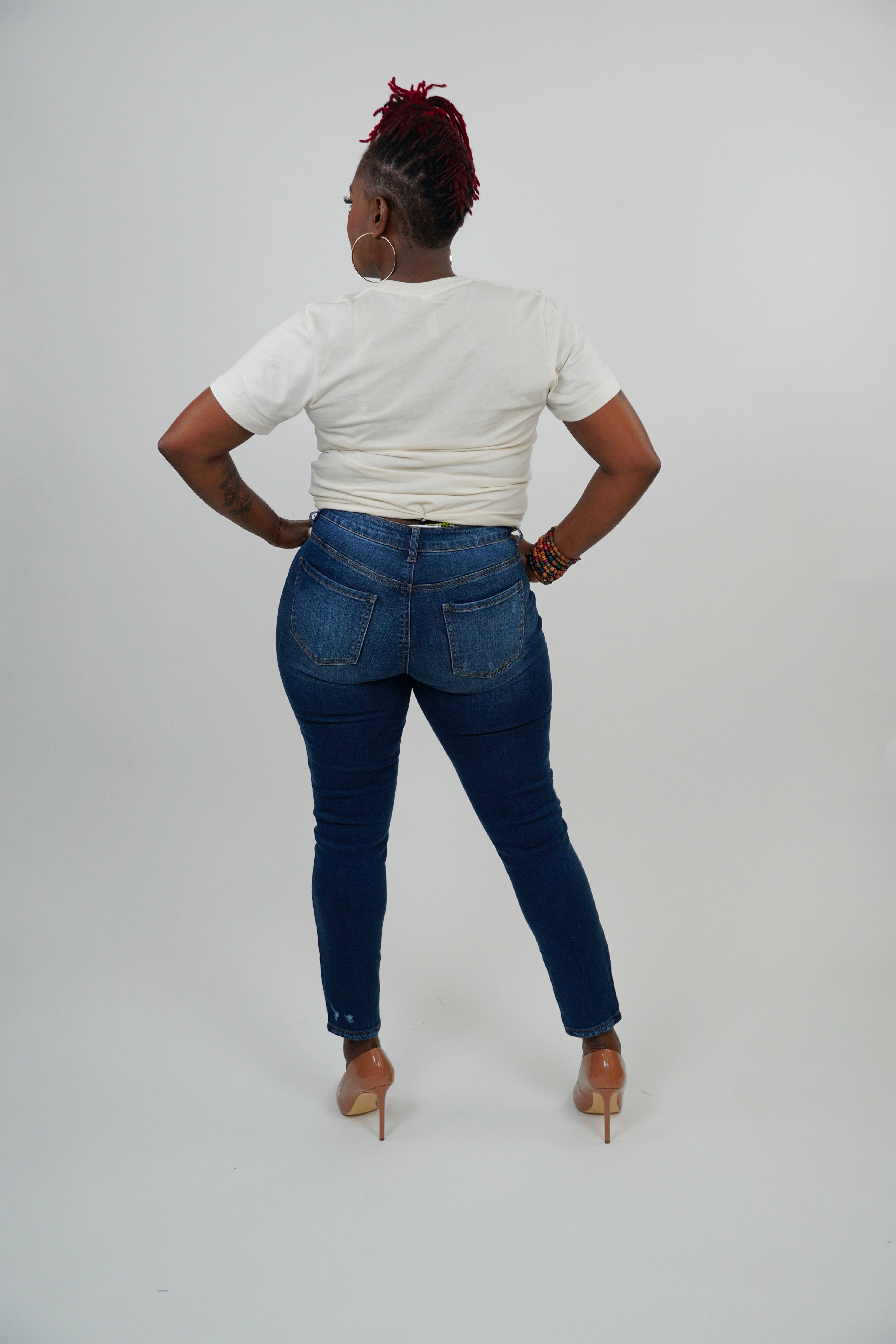 Distressed dark blue jeans